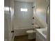 Modern bathroom with a bathtub, shower, and updated fixtures at 555 N Oakland Ave, Indianapolis, IN 46201
