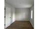 Spacious bedroom with hardwood floors and neutral walls at 555 N Oakland Ave, Indianapolis, IN 46201