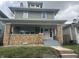 Renovated two-story home with brick facade and updated landscaping at 555 N Oakland Ave, Indianapolis, IN 46201