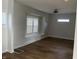 Sunlit living room with hardwood floors and bay window at 555 N Oakland Ave, Indianapolis, IN 46201