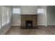 Living room featuring a brick fireplace and hardwood floors at 555 N Oakland Ave, Indianapolis, IN 46201