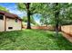Large backyard with green grass and mature trees at 6072 Meridian St W Dr, Indianapolis, IN 46208