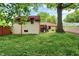 Lush backyard with mature trees, offering privacy and shade at 6072 Meridian St W Dr, Indianapolis, IN 46208