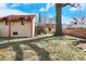 Private backyard with a porch, and manicured landscaping creates a serene retreat at 6072 Meridian St W Dr, Indianapolis, IN 46208