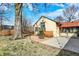 Charming backyard with a small porch, patio, and lush greenery for relaxation and enjoyment at 6072 Meridian St W Dr, Indianapolis, IN 46208