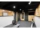 Finished basement gym with rowing machine and weights at 6072 Meridian St W Dr, Indianapolis, IN 46208