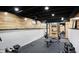 Finished basement features a home gym with weight rack, mirror and flooring at 6072 Meridian St W Dr, Indianapolis, IN 46208
