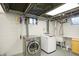 Unfinished basement laundry area with washer and dryer at 6072 Meridian St W Dr, Indianapolis, IN 46208