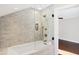 Updated bathroom with glass shower and marble tile at 6072 Meridian St W Dr, Indianapolis, IN 46208