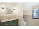 Modern bathroom with green vanity and marble tile at 6072 Meridian St W Dr, Indianapolis, IN 46208