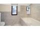 Bathroom with marble tile and bathtub at 6072 Meridian St W Dr, Indianapolis, IN 46208