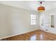 Bright bedroom with hardwood floors and window at 6072 Meridian St W Dr, Indianapolis, IN 46208