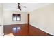 Hardwood floor bedroom with ceiling fan and window at 6072 Meridian St W Dr, Indianapolis, IN 46208