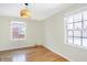 Well-lit bedroom with hardwood floors and window at 6072 Meridian St W Dr, Indianapolis, IN 46208