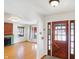 Bright entryway with hardwood floors and view into living room at 6072 Meridian St W Dr, Indianapolis, IN 46208