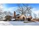 Charming two-story home with snowy yard at 6072 Meridian St W Dr, Indianapolis, IN 46208