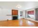 Living room with hardwood floors and fireplace at 6072 Meridian St W Dr, Indianapolis, IN 46208