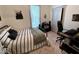 Inviting bedroom with stylish decor, a comfortable bed, and functional workspace at 630 E Mccarty St, Indianapolis, IN 46203