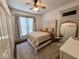 Cozy bedroom with a decorative headboard, large window, and ample natural light at 630 E Mccarty St, Indianapolis, IN 46203