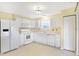 Well-equipped kitchen featuring white cabinets and a breakfast bar at 6670 W Irving Dr, McCordsville, IN 46055