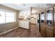 Kitchen with white cabinets, wood floors, and a peninsula counter at 7201 E 71St St, Indianapolis, IN 46256