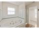 Bathroom with soaking tub, shower, and walk-in closet at 7618 Corsican Cir, Avon, IN 46123