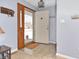 Bright entryway with wood door and tile floor at 9 Whitewood Ct, Beech Grove, IN 46107