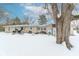 Snowy backyard with patio and detached shed at 9400 N Bishop Ln, Mooresville, IN 46158