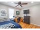 Bright bedroom featuring hardwood floors and a workspace at 9400 N Bishop Ln, Mooresville, IN 46158