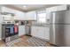 Kitchen with white cabinets, stainless steel appliances, and granite countertops at 9400 N Bishop Ln, Mooresville, IN 46158