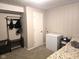 Cozy basement area with neutral walls, carpet flooring, a coat rack, and a chest freezer at 9812 W 900 N Rd, Elwood, IN 46036