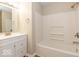 Updated bathroom with white vanity, bathtub, and tiled shower surround at 9812 W 900 N Rd, Elwood, IN 46036