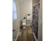 Bathroom with a toilet, towel rack, and a shower behind a decorative shower curtain at 9812 W 900 N Rd, Elwood, IN 46036