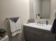 Modern bathroom featuring a sleek vanity, framed mirror, and decorative towels at 9812 W 900 N Rd, Elwood, IN 46036