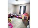 bedroom with toddler beds and play area at 9812 W 900 N Rd, Elwood, IN 46036