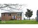 Charming two-story brick home with a well-maintained lawn and inviting front entrance at 9812 W 900 N Rd, Elwood, IN 46036