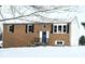Brick ranch home with snow covered yard at 9812 W 900 N Rd, Elwood, IN 46036