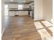 Modern kitchen featuring stainless steel appliances and light wood flooring at 9812 W 900 N Rd, Elwood, IN 46036