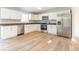 Modern kitchen with stainless steel appliances and white cabinetry at 9812 W 900 N Rd, Elwood, IN 46036