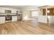 Open concept kitchen with stainless steel appliances and light wood flooring at 9812 W 900 N Rd, Elwood, IN 46036