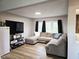 Cozy living room with a comfortable sectional sofa and natural light at 9812 W 900 N Rd, Elwood, IN 46036