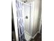 Clean shower stall with gray shower curtain and new fixtures at 9812 W 900 N Rd, Elwood, IN 46036