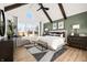 Spacious main bedroom featuring high ceilings, exposed beams, and natural light from large windows at 11430 Aubrey Ln, Fishers, IN 46040