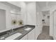 Elegant bathroom featuring double sinks, sleek countertops, and a walk-in shower at 11614 Hartwell St, Indianapolis, IN 46235