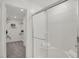 Bright and clean bathroom with a glass-enclosed shower and walk-in closet at 11614 Hartwell St, Indianapolis, IN 46235