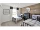 Cozy bedroom with two twin beds, wood wall decor, and a window at 11614 Hartwell St, Indianapolis, IN 46235