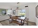 Bright dining room with a wood table set and a view of the outdoors through sliding glass doors at 11614 Hartwell St, Indianapolis, IN 46235