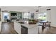 Open kitchen concept with island, view to dining area, and living room at 11614 Hartwell St, Indianapolis, IN 46235