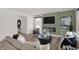 Cozy living room with a modern fireplace, comfortable seating, and stylish decor at 11614 Hartwell St, Indianapolis, IN 46235