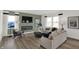 Stylish living room with modern fireplace, comfortable seating, and large windows at 11614 Hartwell St, Indianapolis, IN 46235